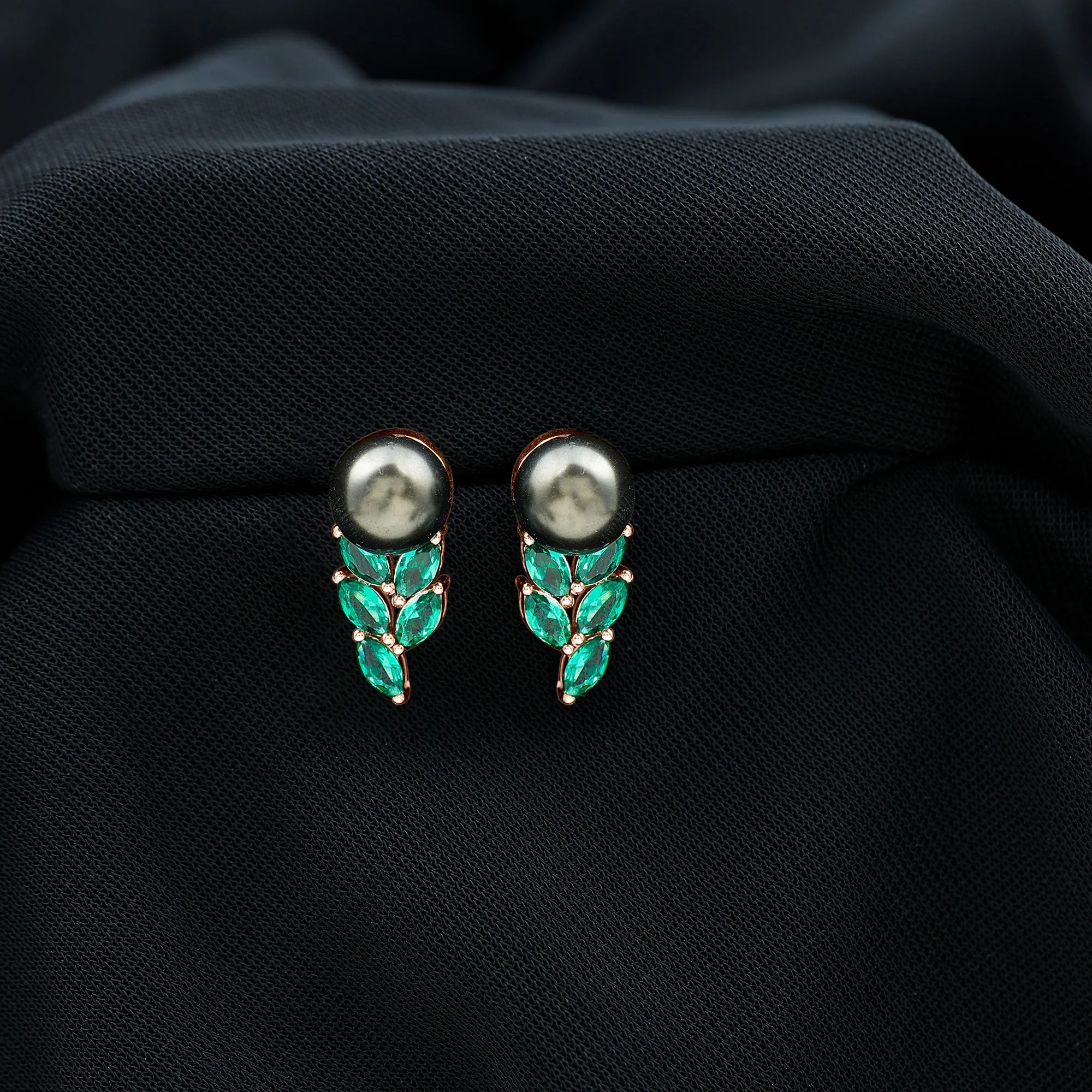 Nature Inspired Black Pearl Stud Earrings with Emerald Leaf Motifs