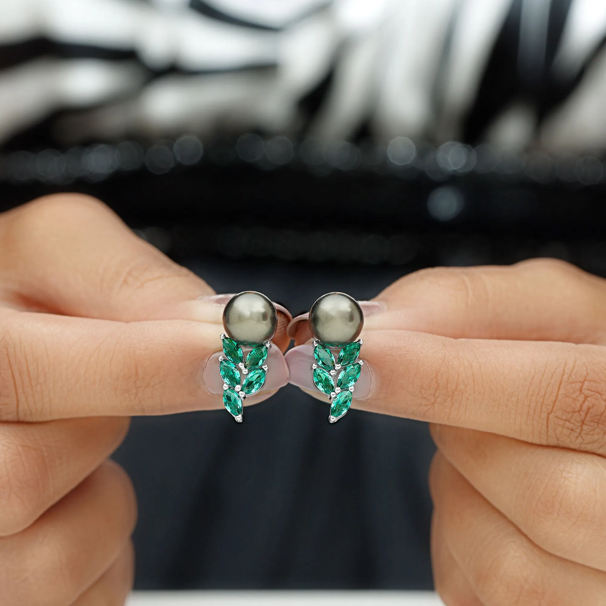Nature Inspired Black Pearl Stud Earrings with Emerald Leaf Motifs