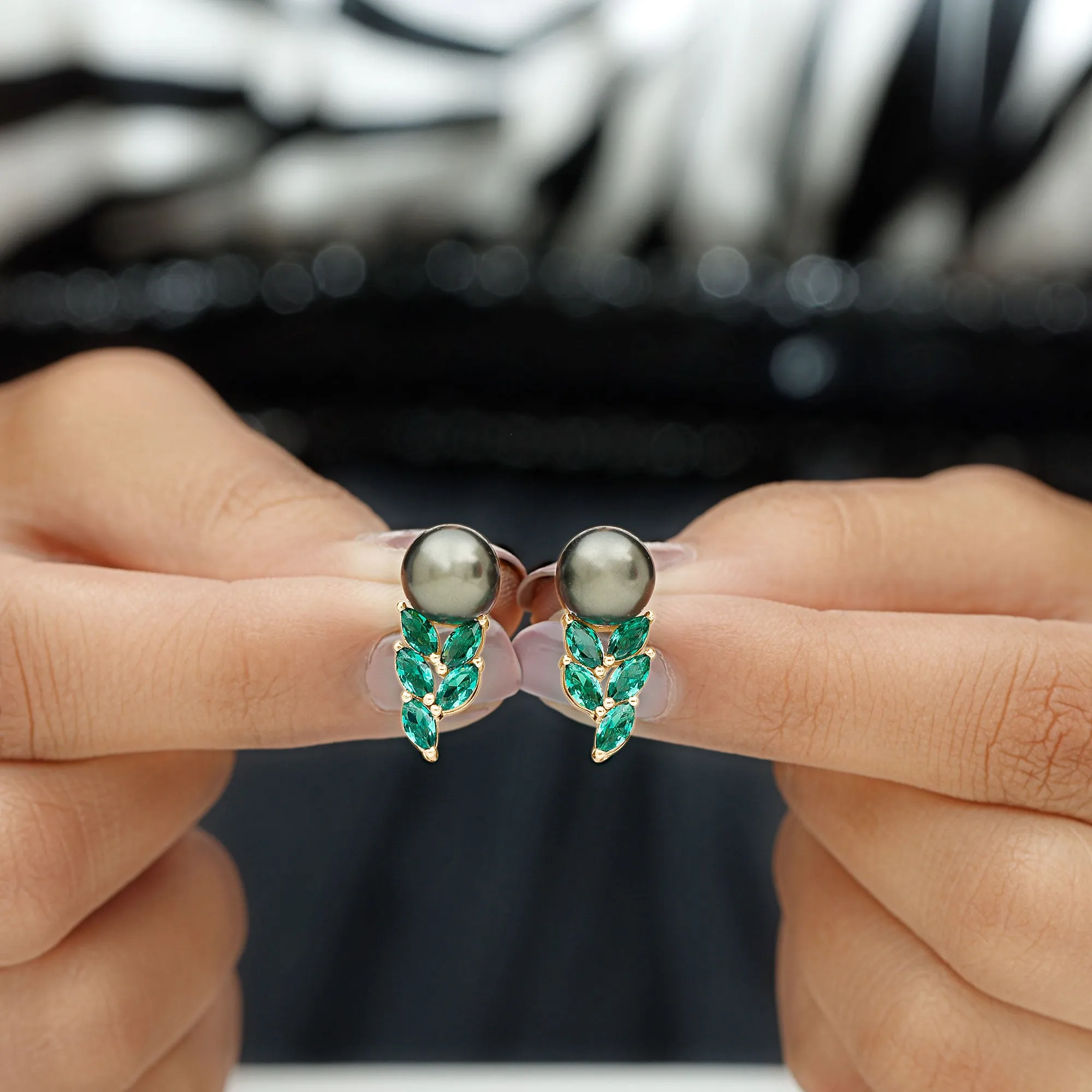 Nature Inspired Black Pearl Stud Earrings with Emerald Leaf Motifs