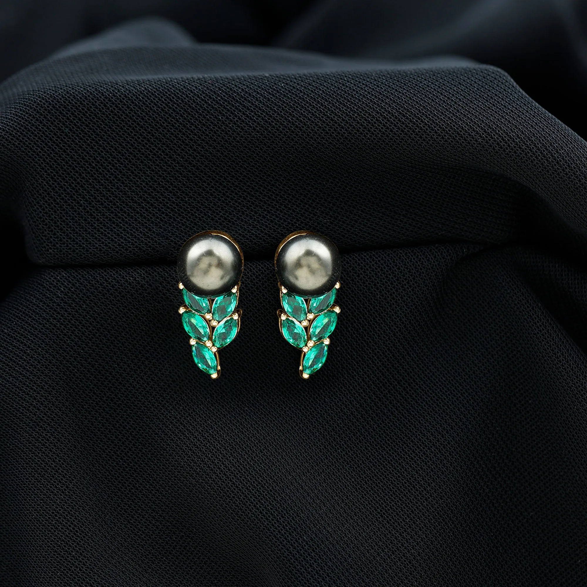 Nature Inspired Black Pearl Stud Earrings with Emerald Leaf Motifs